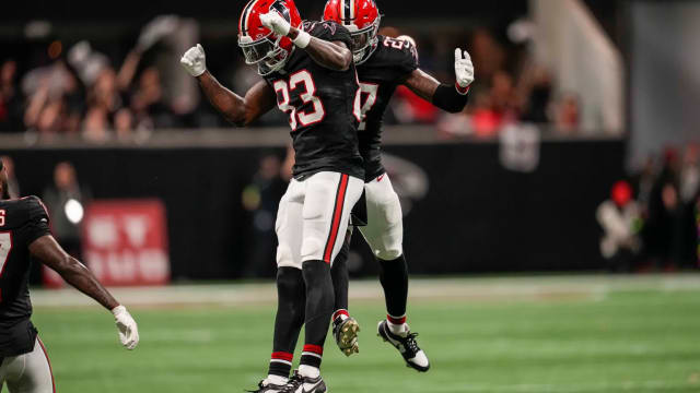 Nov 26, 2023; Atlanta, Georgia, USA; Atlanta Falcons defensive tackle Calais Campbell (93) and safety Richie Grant (27) react after defeating the New Orleans Saints at Mercedes-Benz Stadium.